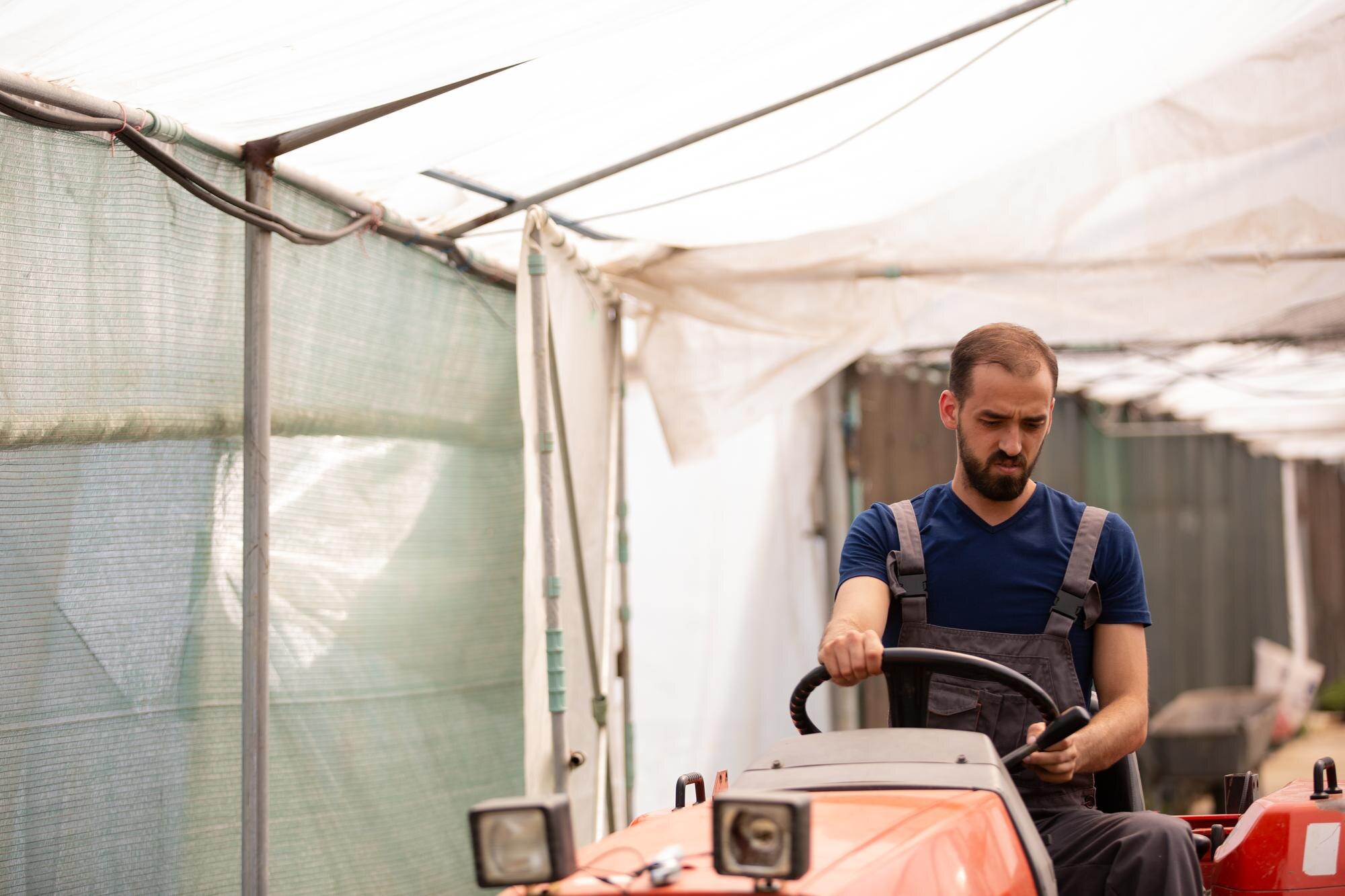 farmer-sitting-tractor-sunny-day-greenhouse-rural-activity