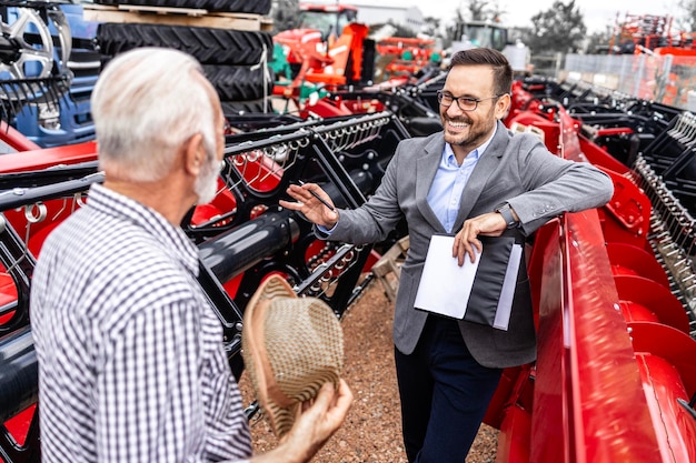salesman-farmer-discussing-about-farming-equipment-purchase-agricultural-machinery